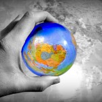 hand holding a globe