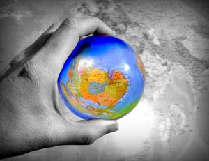 hand holding a globe